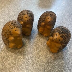 Four hedgehog salt,and pepper shakers.